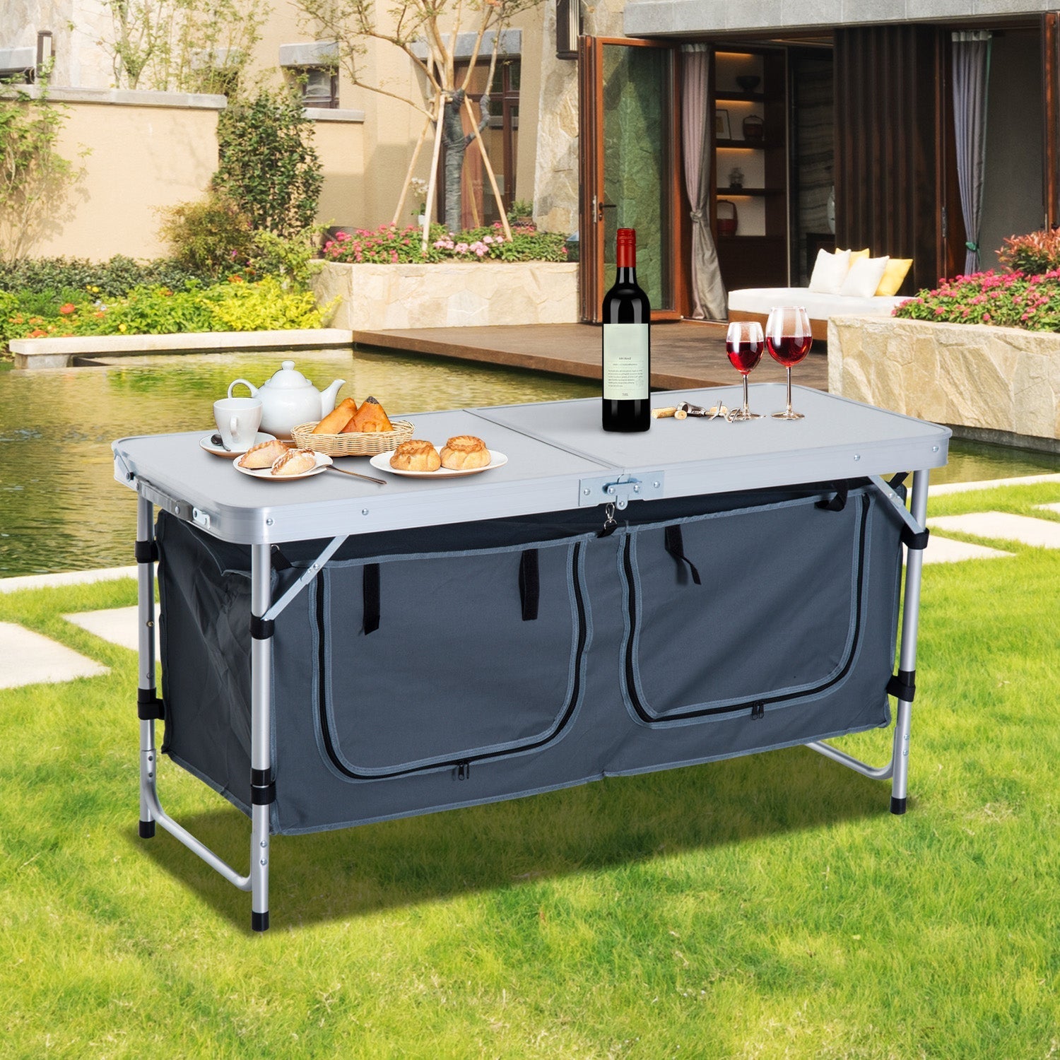 Durable foldable camping table set up outdoors with wine, glasses, and snacks for a perfect meal experience