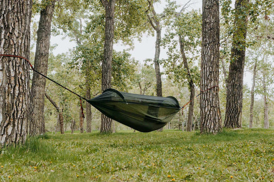Grey Erebus camping hammock with mosquito net for comfortable outdoor relaxation in nature