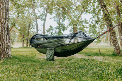Grey Erebus camping hammock with mosquito net for outdoor relaxation and bug protection